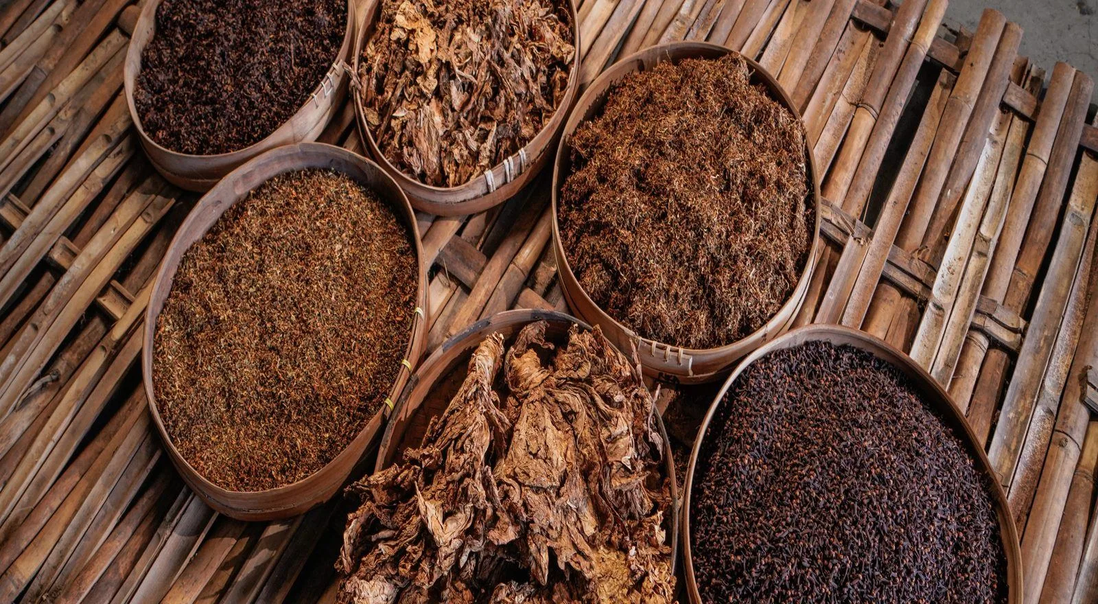 Wooden bowls of dried tobacco leaf