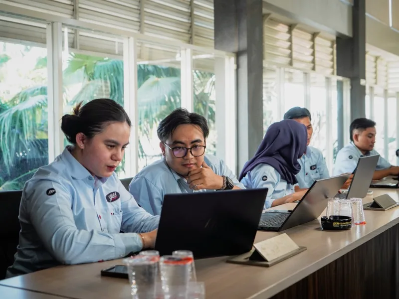 Team members reviewing work together